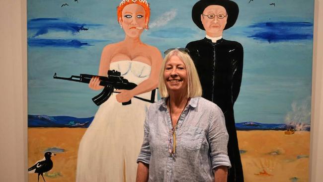 LOVE IT: Local artist Sandra Allen and her painting  The Bride Waited and Waited . Her exhibition opens tonight at the Roma on Bungil Gallery. Picture: Ellen Ransley