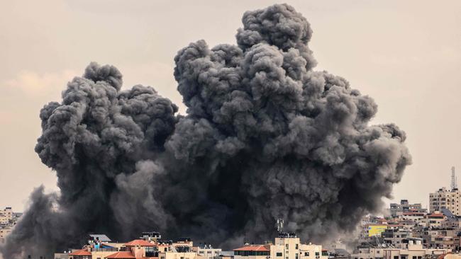 A plume of smoke rises in the sky of Gaza City during an Israeli air strike on October 9, 2023. Picture: AFP