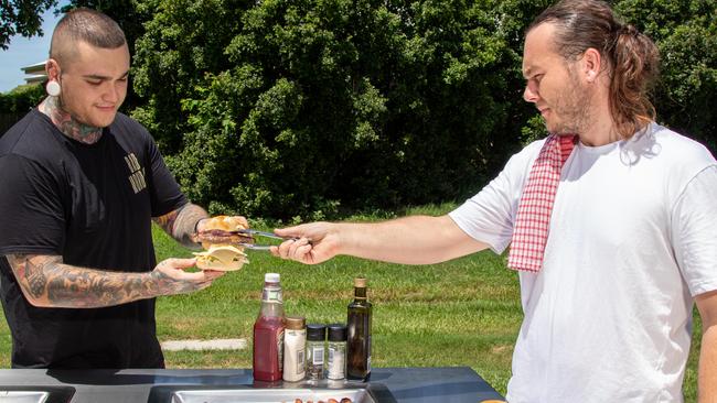 Marcus and Alex Kimmins from award-winning local business Greenplate at one of their barbecues, installed in the Redlands. The business has installed their public-use barbecues at council-run parks including at Raby Bay, Wellington Point and Birkdale.