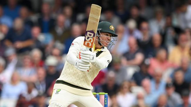 David Warner punches a ball through the covers. (Photo by Stu Forster/Getty Images)