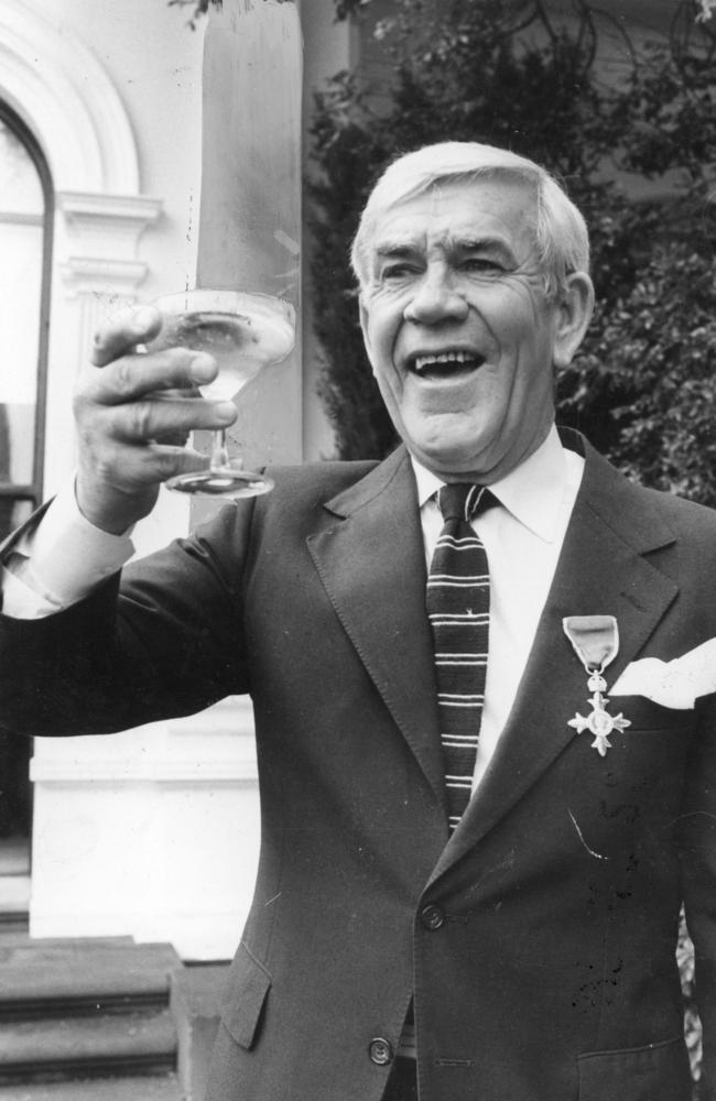 Lou Richards celebrating his MBE at Government House in 1982.