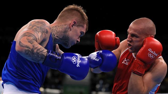 Tomasz Jablonski of Poland (Red) fights against Daniel Jason Lewis of Australia in their men’s middleweight 75kg bout on Day 4 of the Rio 2016 Olympic Games. (Photo by Mike Ehrmann/Getty Images)