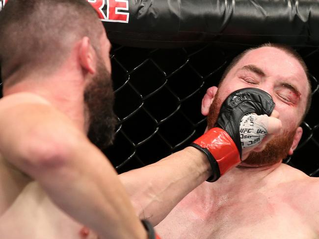 UFC - Adelaide Entertainment Centre. Coaching from the sidelines in the Vik Grujic (dark hair) and Brendan O'Reilly (Reddish beard green shorts) Welterweight bout. Photo Sarah Reed.