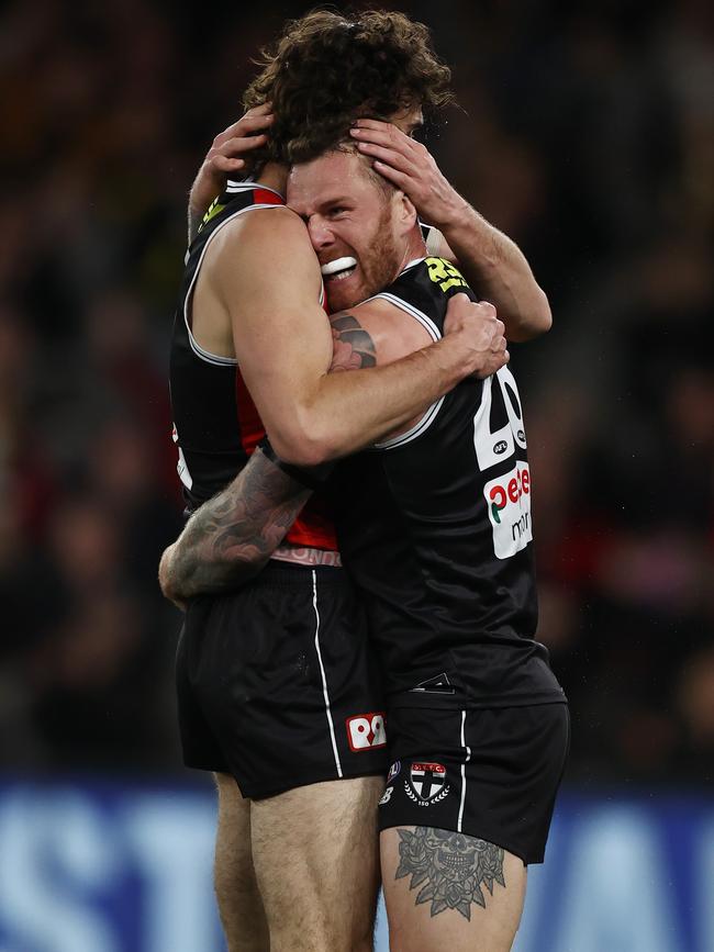 Tim Membrey and Max King celebrate a goal with a hug. Photo by Michael Klein.