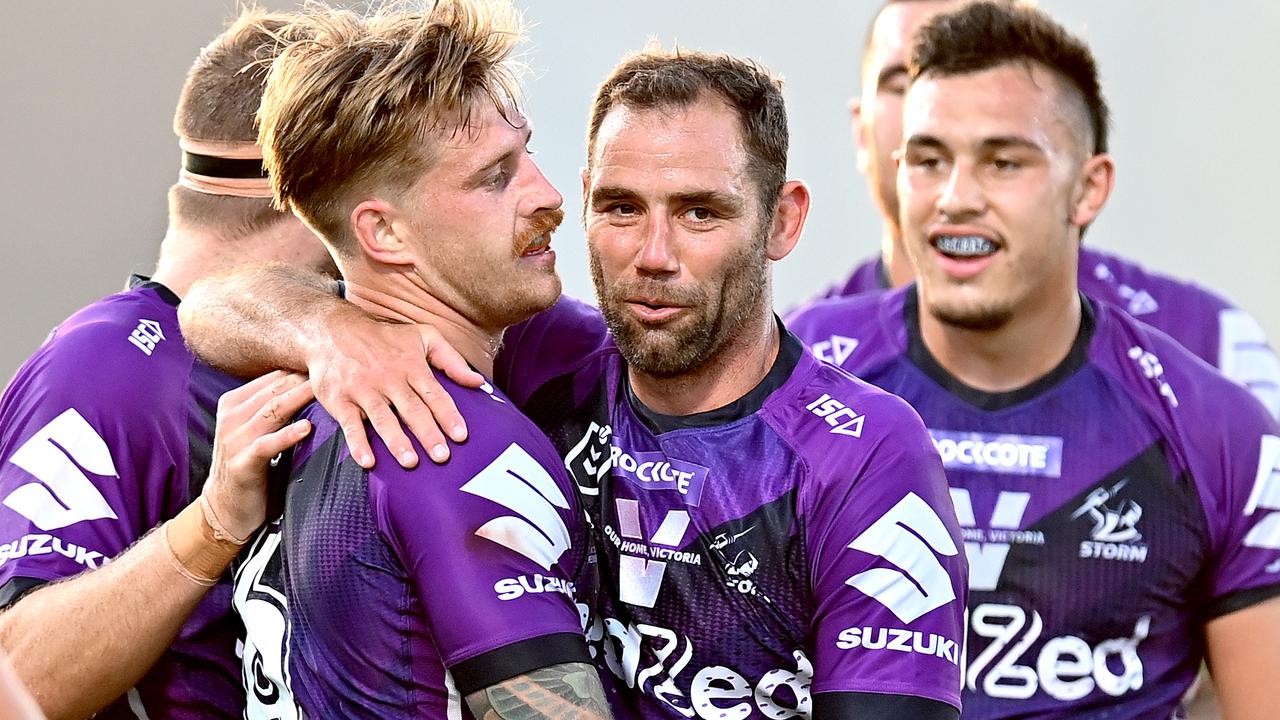 SUNSHINE COAST, AUSTRALIA – SEPTEMBER 13: Cameron Munster of the Storm is congratulated by teammates Cameron Smith after scoring a try during the round 18 NRL match between the Melbourne Storm and the North Queensland Cowboys at [VEUNE] on September 13, 2020 in Sunshine Coast, Australia. (Photo by Bradley Kanaris/Getty Images)