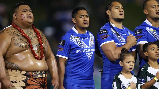 SYDNEY, AUSTRALIA - JUNE 22: (L-R) Anthony Milford, Martin Taupau and James Gavet of Samoa sing the national anthem during the Pacific International Test Match between Samoa and Papua New Guinea at Leichhardt Oval on June 22, 2019 in Sydney, Australia. (Photo by Jason McCawley/Getty Images)