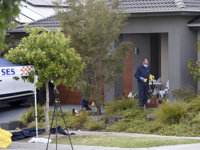 Police investigate the area around Observatory St at Clyde North on Friday. Picture: Andrew Henshaw