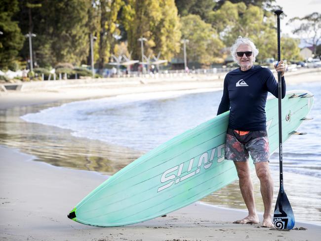 Steven Last felt like he was dancing on water after paddle boarding in perfect weather conditions at Long Beach, Sandy Bay. Picture: Chris Kidd