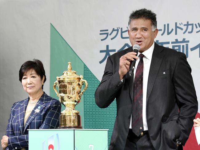 Japan's Head Coach Jamie Joseph, right, speaks beside Tokyo Gov. Yuriko Koike and the trophy of Rugby World Cup as Japan began its two-year countdown to the 2019 Rugby World Cup, in Tokyo, Monday, Sept. 18, 2017. Venues for the 48 games will be announced on Nov. 2. (Akiko Matsushita/Kyodo News via AP)