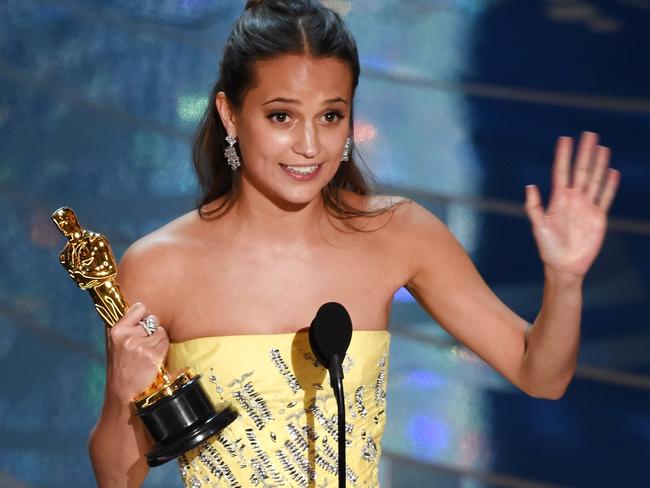 Alicia Vikander accepts the Best Supporting Actress award.