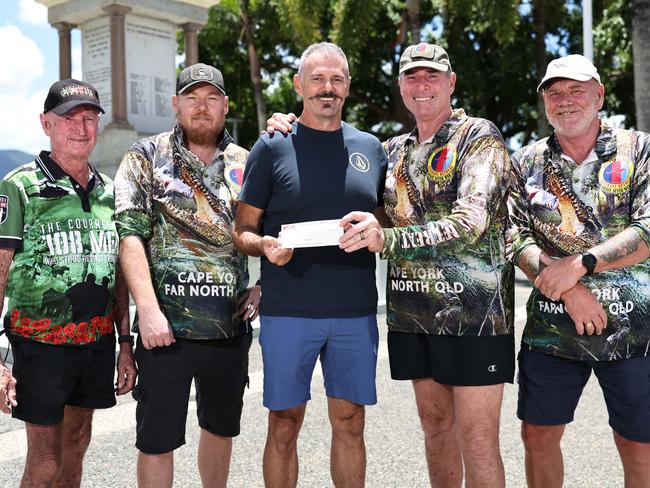 Veteran Adrian Spencer's son Alec was involved in a motorcycle accident and flown to Brisbane for medical treatment. Fellow veterans from the Pandanus Park War VeteranÃs Retreat members Noel "Buzz" Berzinski, Chris Stacey, Roly Walker and Phil Wray have fundraised to help Adrian (centre) cover his travel and accommodation costs while in Brisbane. Picture: Brendan Radke