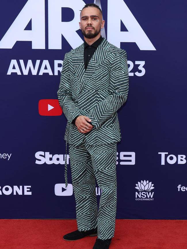 You could mistake Koby Dee for an optical illusion in this green striped suit. (Photo by Mark Metcalfe/Getty Images)