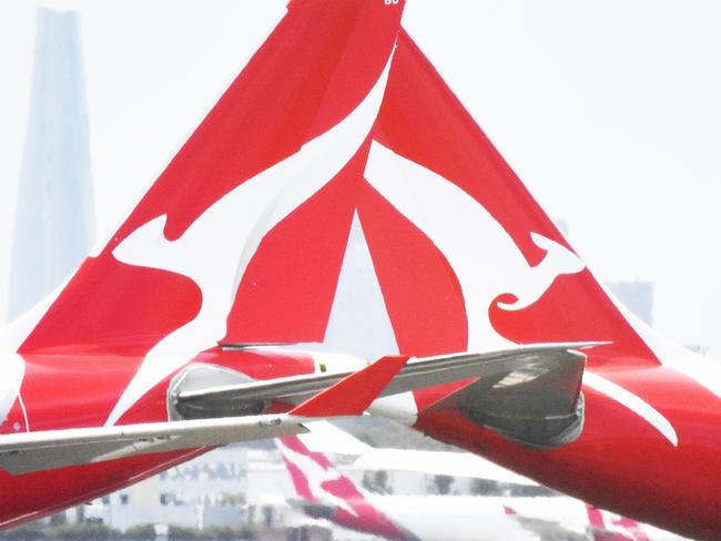 Qantas aircraft are seen at Sydney Airport, Thursday, 24 December 2020. Authorities are urgently investigating how a Qantas crew member contracted Covid-19 after arriving in Darwin from Paris and then flying to Sydney without being tested or quarantined. Federal health authorities are working with Qantas to understand how the man, who landed in Darwin on 17 December after working on a repatriation flight from Paris, became infected. Picture - Sam Mooy/The Australian Newspaperescape january 17 2021doc holiday