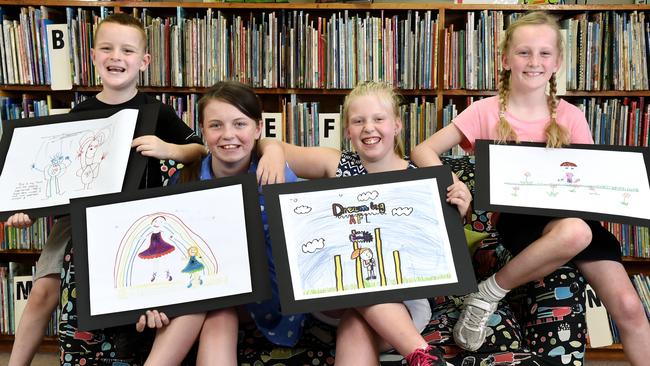 Students with the posters they created: Oliver 5, Charli 11, Isabella 10 and Mia 9. Picture: Kylie Else