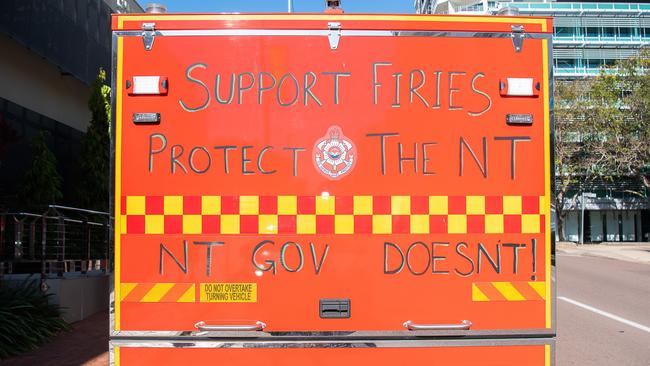 Firefighters have written slogans on their trucks calling on the NT government to step up in their pay negotiation with the United Workers Union. Picture: Pema Tamang Pakhrin