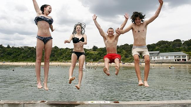 Locals cool off at the beach on a hot summer's day in Black Rock. 