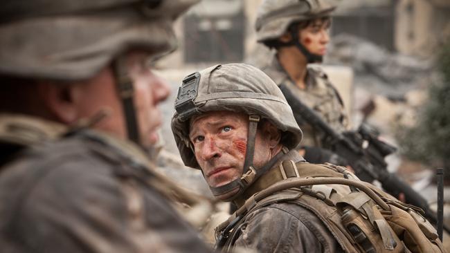 Aaron Eckhart fights aliens in Battle: Los Angeles.