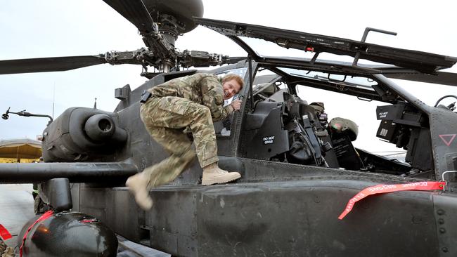In action ... Prince Harry makes early morning checks on an Apache helicopter at the British-controlled flight-line at Camp Bastion in Afghanistan on December 12, 2012. Pic: WPA Pool/Getty Images