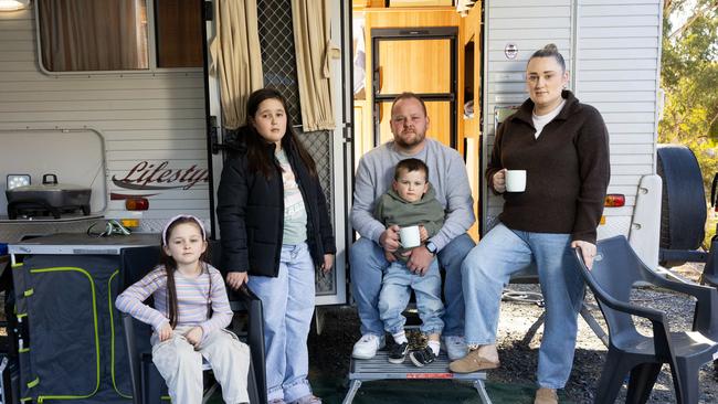 Jarrad and Caitlin Brown with their children Zara 11yrs, Harlow 7yrs and Harvey 3yrs who are living in a caravan as their home is completed. Picture: Emma Brasier