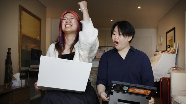 Eli Xiang and Sydney Bao opening their 2023 HSC ATAR results online to discover that Eli achieved 99.45 and Sydney achieved 99.90. Picture: Richard Dobson