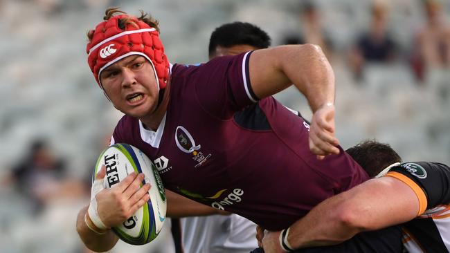 Harry Wilson attempts to break the tackle of his Brumbies opponent. Picture: Tracey Nearmy/Getty Images