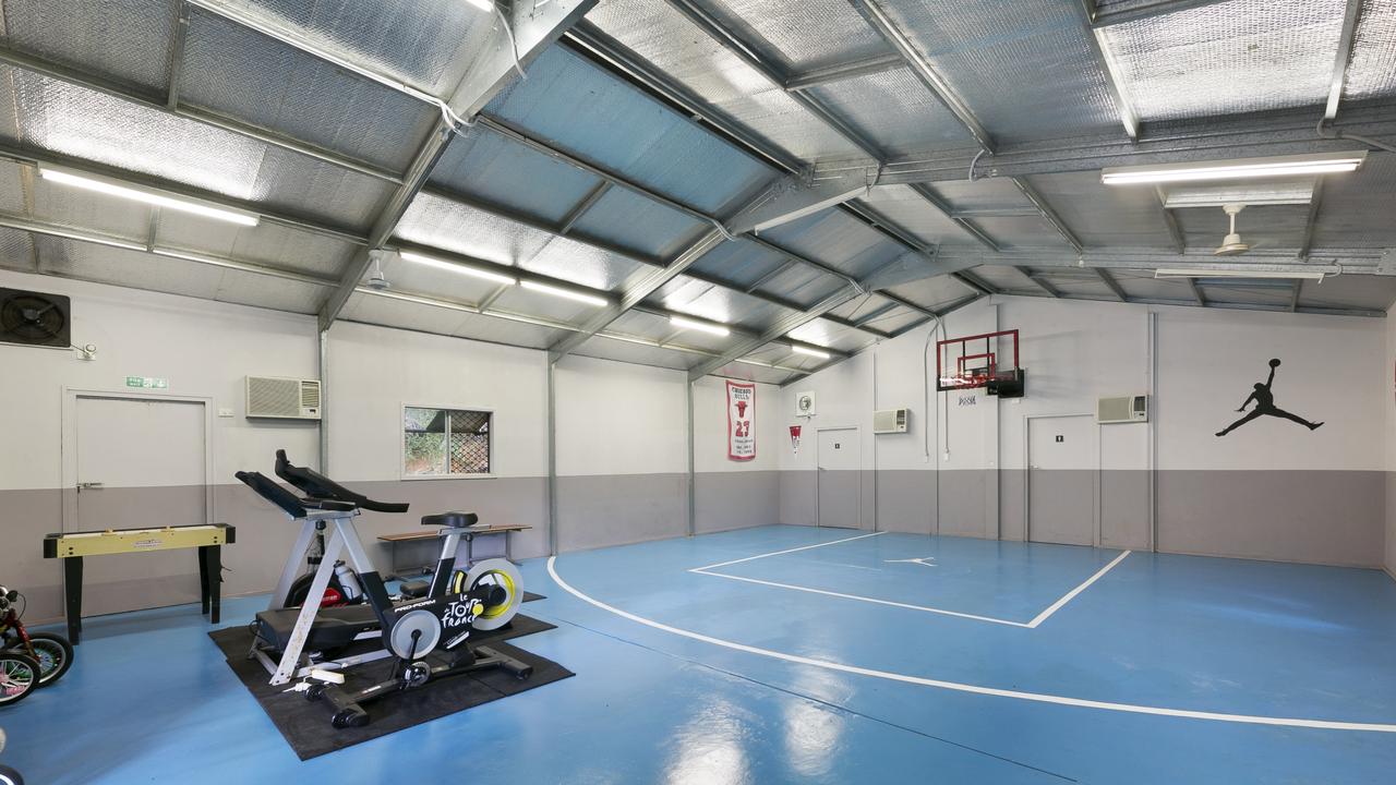 As if 2.5ha of bushland with walking tracks and a summer creek to explore weren’t enough, this amazing Gold Coast acreage caters for year-round fun with an indoor basketball court and go-kart track, each housed in separate sheds on the property.