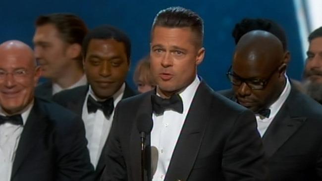 12 Years a Slave producer Brad Pitt accepts the Best Picture award. 