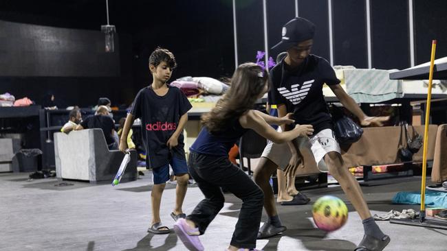 Internally displaced children play soccer at a discotheque converted into an IDP shelter on Thursday in Beirut. Picture: Getty Images