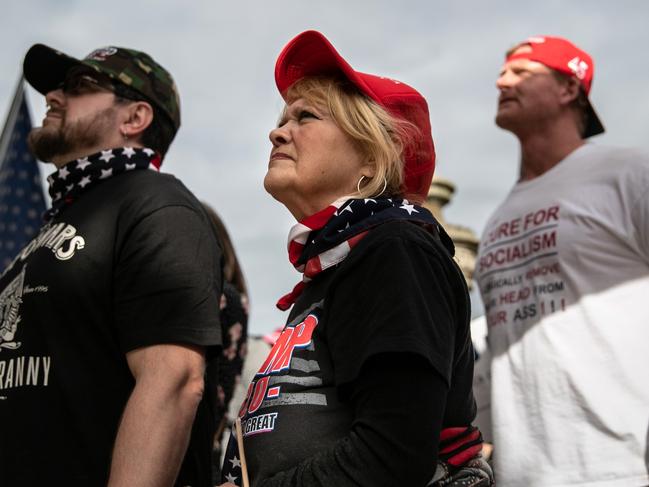 LANSING, MICHIGAN - NOVEMBER 08: Trump supporters demonstrate at the Michigan state capitol on November 08, 2020 in Lansing, Michigan. Militia members had pledged to attend the "Stop the Steal" demonstration by Trump supporters, claiming the presidential election had been stolen.   John Moore/Getty Images/AFP == FOR NEWSPAPERS, INTERNET, TELCOS & TELEVISION USE ONLY ==