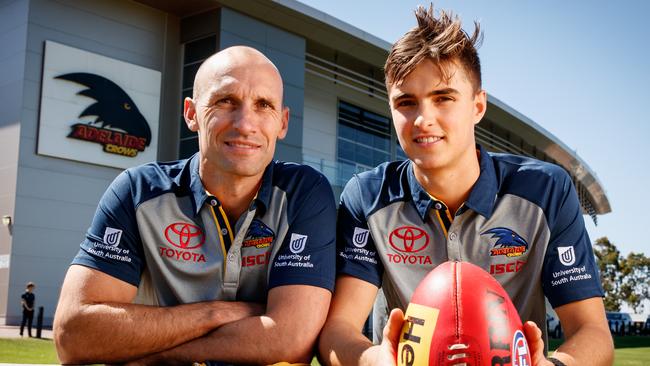 Tyson Edwards, with son Jackson who was cut by the Crows after one season in 2018, believes there are positives happening behind the scenes despite the club’s winless start. Picture: Matt Turner.