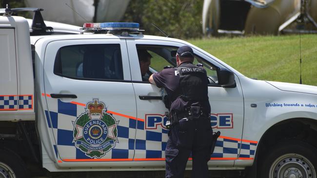 Police investigate the scene on the banks of the Burnett River and interview boaties following a serious boat crash.