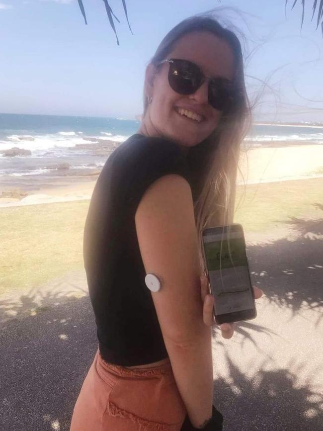 Sarah, wearing a device which helps her closely monitor where her blood glucose level is going.