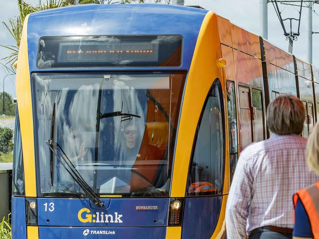 Opening morning of the Stage 2 of the Gold Coast light rail (g:link). The crowds wait as the light rail tram enters the station at Helensvale.  Picture: Jerad Williams