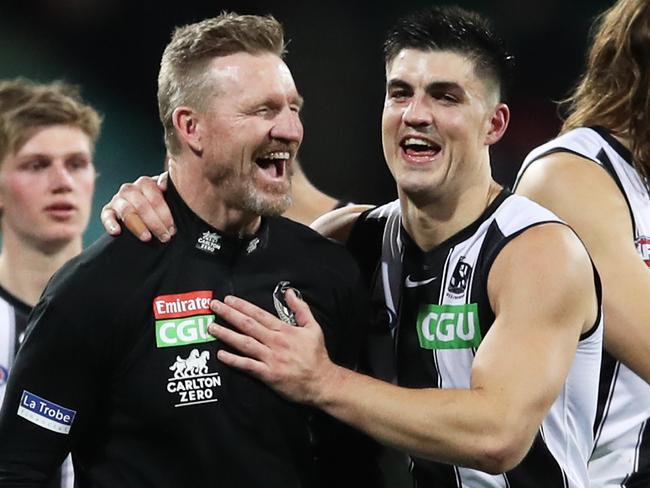 SYDNEY, AUSTRALIA - JUNE 14: Magpies head coach Nathan Buckley celebrates victory with Brayden Maynard of the Magpies and team mates after the round 13 AFL match between the Melbourne Demons and the Collingwood Magpies at Sydney Cricket Ground on June 14, 2021 in Sydney, Australia. (Photo by Matt King/Getty Images)