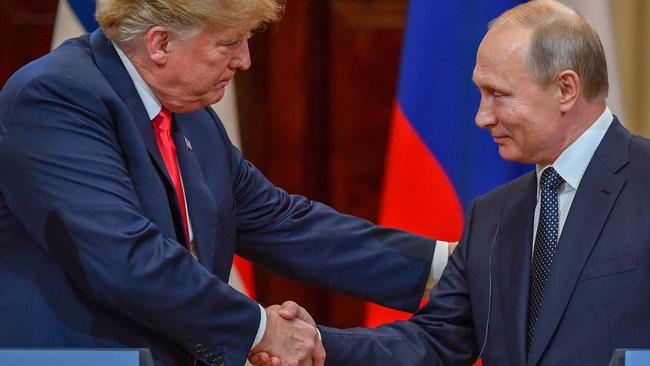 US President Donald Trump and Russia's President Vladimir Putin shake hands after a meeting at the Presidential Palace in Helsinki in 2018. Picture: Yuri Kadobnov/AFP
