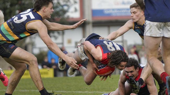 Samuel Collins takes a tumble for Old Brighton. Picture: Valeriu Campan