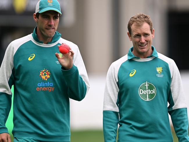 HOBART, AUSTRALIA - JANUARY 12: Pat Cummins Captain of Australia and George Bailey Chairman of Selectors walk the field  during an Australian Ashes squad nets session at Blundstone Arena on January 12, 2022 in Hobart, Australia. (Photo by Steve Bell/Getty Images)