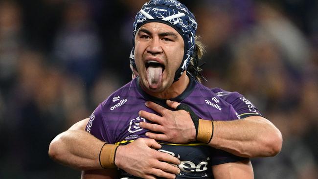 MELBOURNE, AUSTRALIA - SEPTEMBER 27: Jahrome Hughes of the Storm celebrates scoring a try during the NRL Preliminary Final match between the Melbourne Storm and Sydney Roosters at AAMI Park on September 27, 2024 in Melbourne, Australia. (Photo by Quinn Rooney/Getty Images)