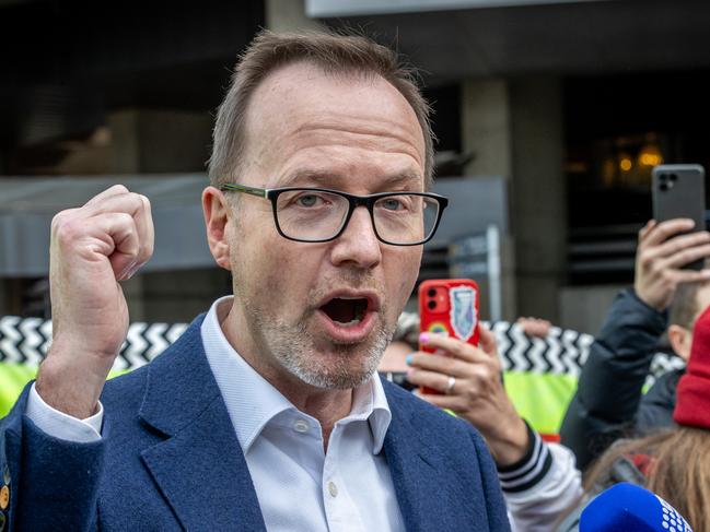 Anti-war activists attempt to disrupt the Land Forces 2024 International Land Defence Exposition at the Melbourne Convention and Exhibition Centre. Greens Senator David Shoebridge visits protesters before speaking to the media. Picture: Jake Nowakowski