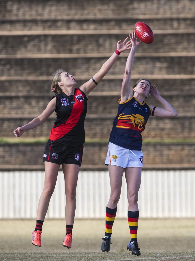 Alexandra Walters (left) of South Toowoomba competes for possession against Georgia Coonan of University in AFL Darling Downs senior women's round 9 at Heritage Oval, Saturday, June 19, 2021. Picture: Kevin Farmer