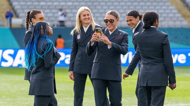 AUCKLAND, NEW ZEALAND - JULY 22: Trinity Rodman #20 talks a photo of Crystal Dunn #19 of the United States  before a FIFA World Cup Group Stage game between Vietnam and USWNT at Eden Park  on July 22, 2023 in Auckland, New Zealand. (Photo by Brad Smith/USSF/Getty Images for USSF).