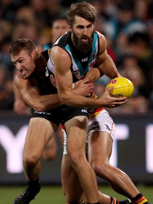 Crows Daniel Talia tackles Port Adelaide’s Justin Westhoff  in Showdown 46 at Adelaide Oval. Picture: James Elsby/Getty