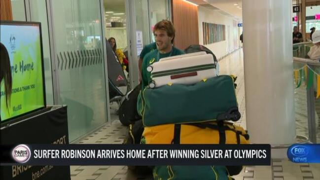 Jack Robinson returns after winning silver in the Olympic surfing