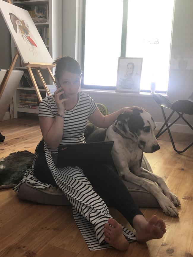 This harlequin Great Dane is available for pats for those who like to multi-task or just get a good work-life balance. Picture: Lydia Kellner<br/>