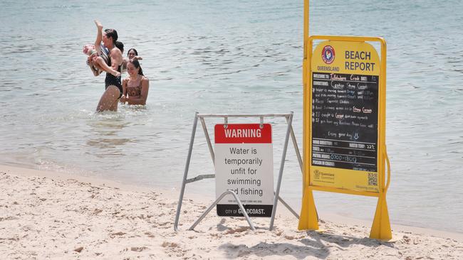 People still swimming in Tallebudgera Creek despite beach closure signs and warnings from lifesavers. The creek was closed following a sewerage spill upstream. Picture Glenn Hampson