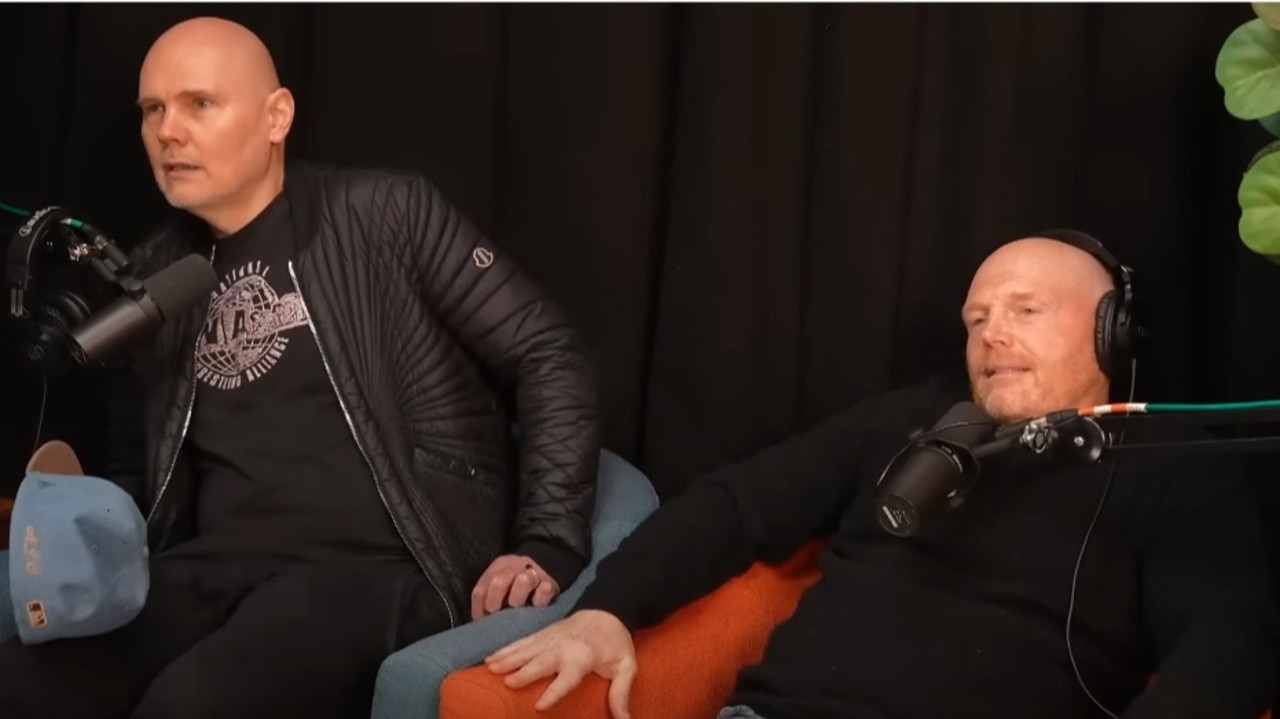 Billy Corgan (left) takes a seat, as Bill Burr immediately asks the hosts if the whole segment can be edited out.