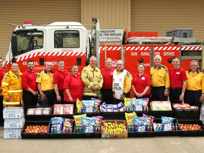 Coles CEO Steven Cain with Wauchope and King Creek Rural Fire Brigades and Coles team members. Picture: Peter Lorimer