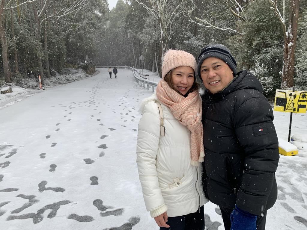 Rosarie and Oliver Quing from Perth WA enjoying the snow on kunanyi/Mt Wellington on June 7 2022