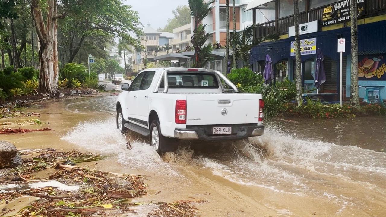 A large high tide and strong winds combined with the arrival of Tropical Cyclone Jasper in Far North Queensland to flood Williams Esplanade at Palm Cove, Cairns. Picture: Bronwyn Farr