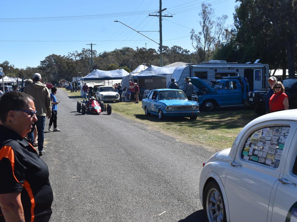 Spectators look at oncoming cars (Photo: Michael Hudson / Warwick Daily News)